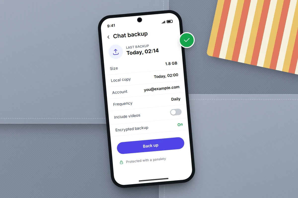 Phone on a grey sofa cushion showing a chat backup screen: last backup today at 02:14, 1.8 GB, daily, videos off, encryption on