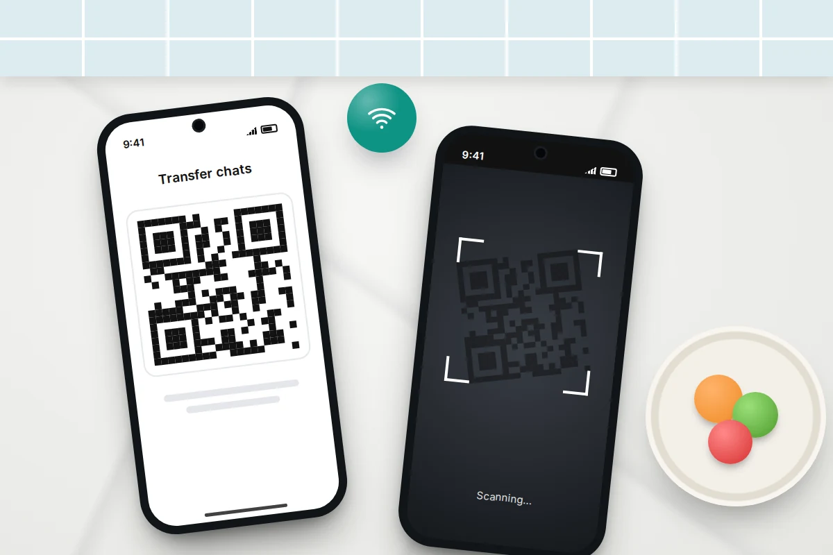 Two phones on a kitchen worktop, one showing a QR code and the other scanning it, with a Wi-Fi symbol between them