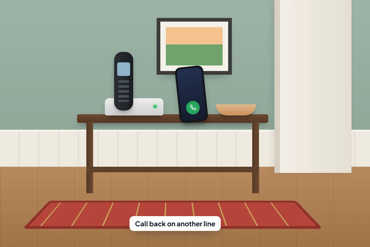 Hallway table with a cordless landline in its cradle and a mobile phone propped up beside it