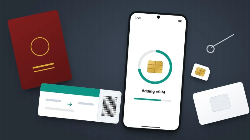 A phone downloading an eSIM beside a punched-out SIM card, an ejector pin, a boarding pass and a passport