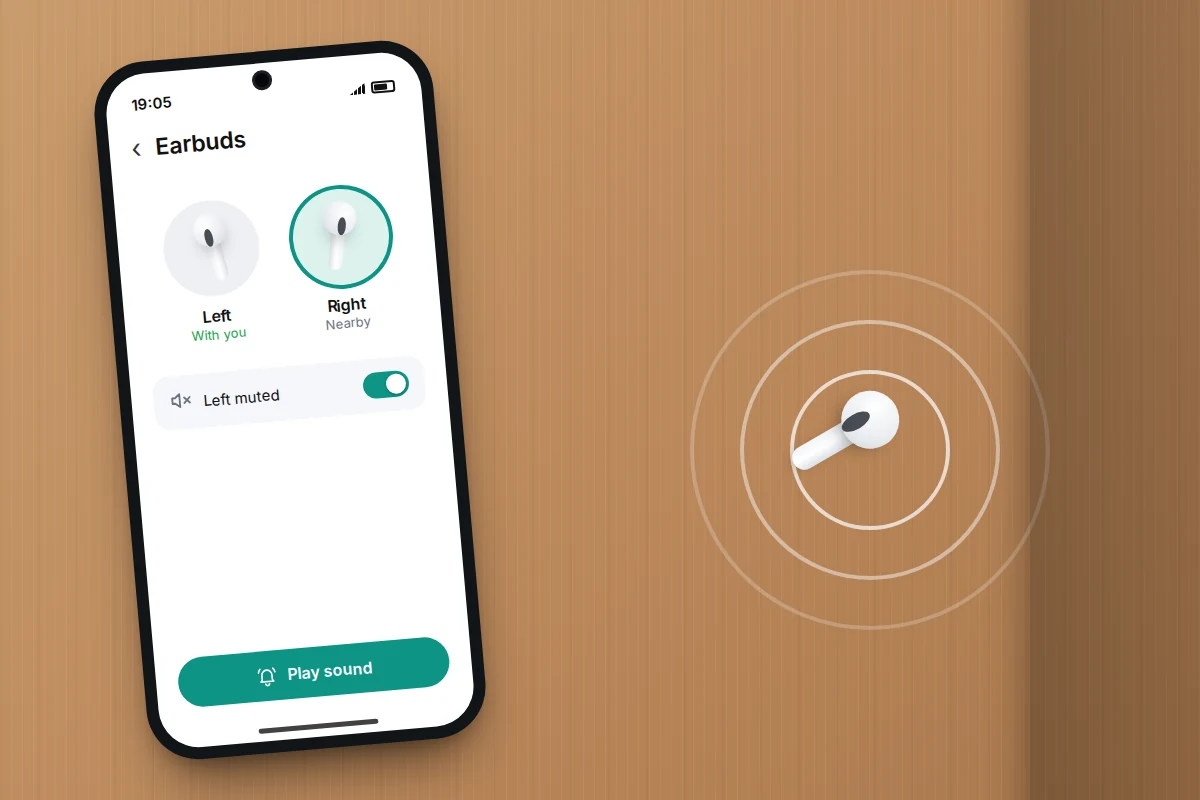 A phone with left and right earbud buttons and the left side muted, beside a lone earbud on a wooden floor giving off sound waves