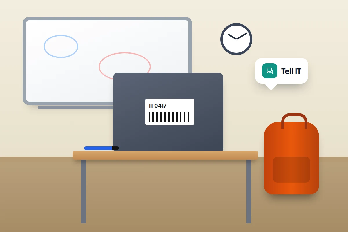 A classroom desk with a laptop whose lid carries an IT asset tag, a school bag and a speech bubble saying Tell IT