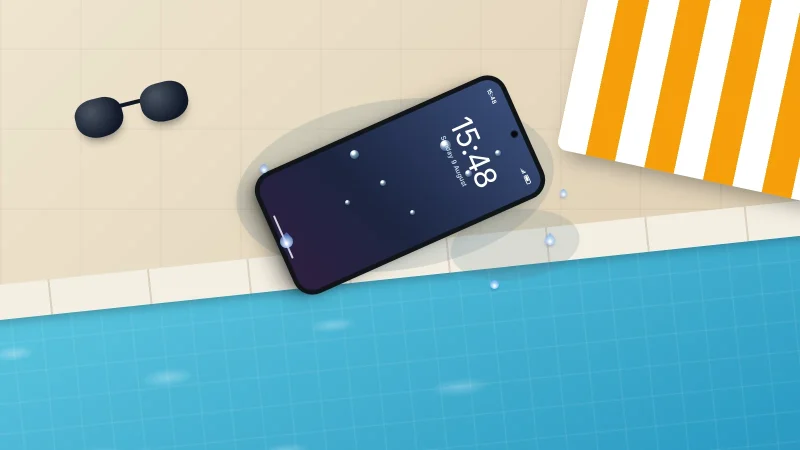 A wet phone with water beads on its screen lying on the tiled edge of a swimming pool, beside a striped towel and goggles