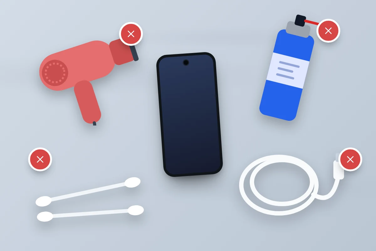 Four crossed-out items on a table: a hairdryer, a can of compressed air, cotton buds and a charging cable