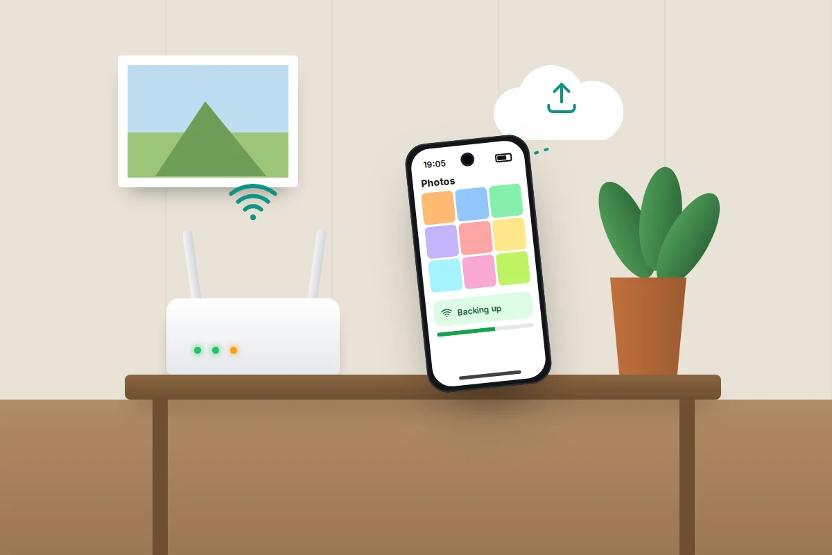 A phone on a hall table beside a home router, backing up photos over Wi-Fi to the cloud