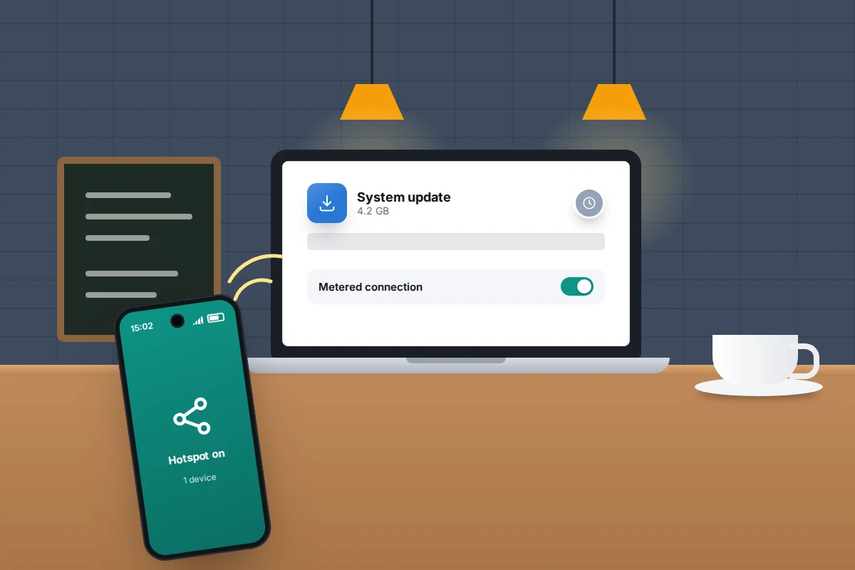 A phone sharing its connection to a laptop on a café table, with a large update download paused on the laptop