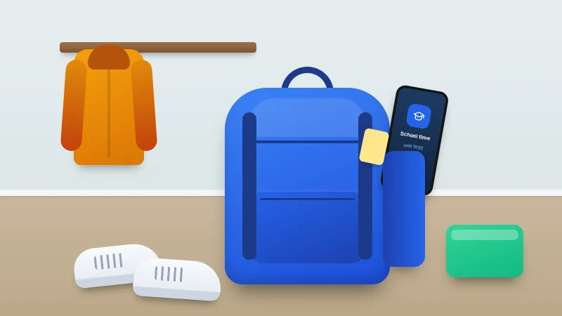 A school backpack by a coat hook with a phone in its side pocket showing a school time screen
