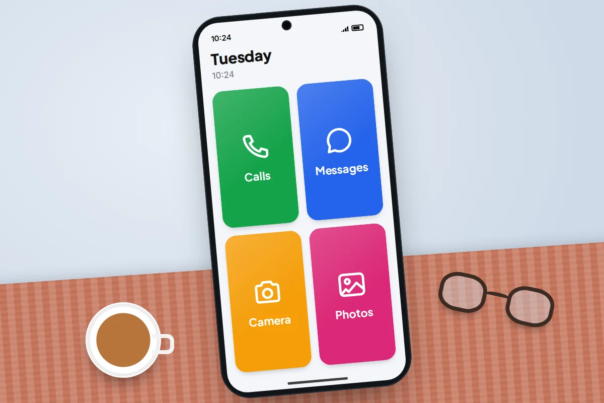 Close-up of a phone showing four large tiles for calls, camera, messages and photos in a simple grid