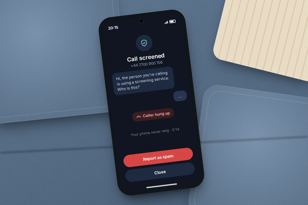 Phone on a sofa cushion showing a screened call where the caller hung up, with a report as spam button